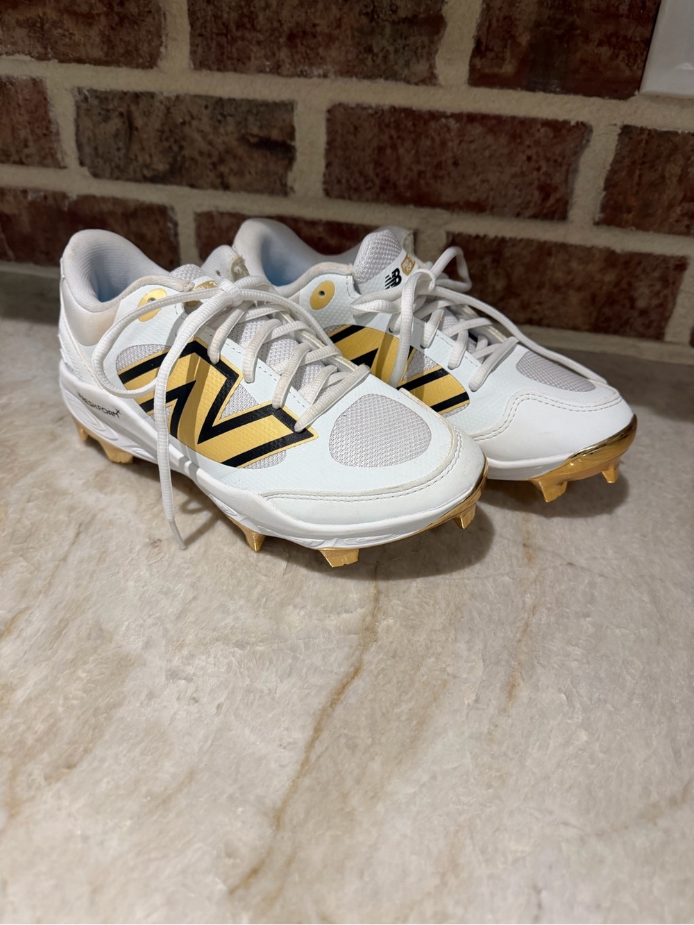 New Balance Women’s Softball Cleats, white and gold